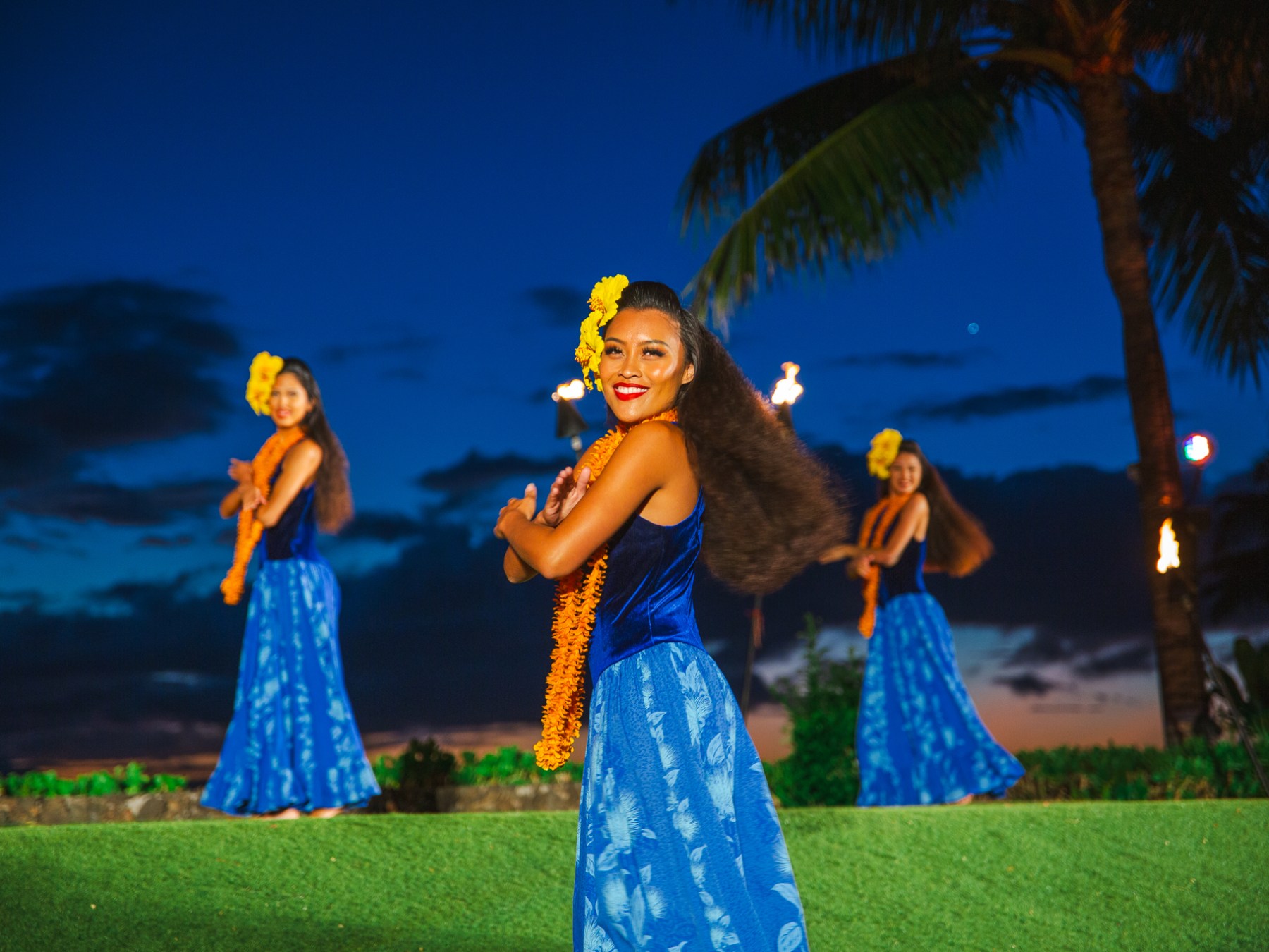 Three Kauai Women in Blue Dancing the Luau