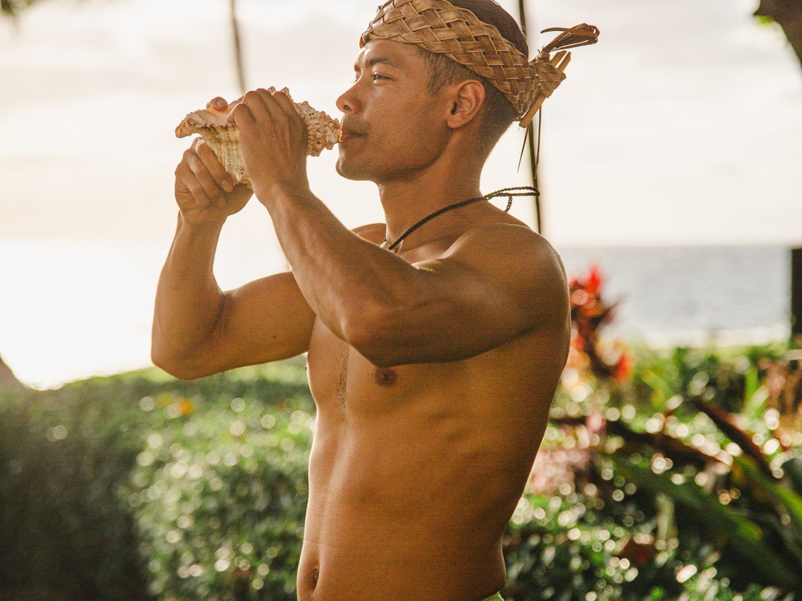 Kauai Man Blowing a Conch Shell